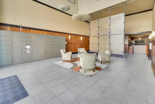 a living room with patio furniture and a table