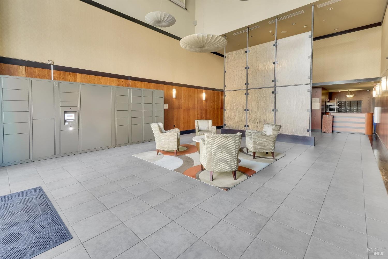 423 7th Street, Unit 105 Oakland, CA 94607 - Photo 2 of 28 a living room with patio furniture and a table