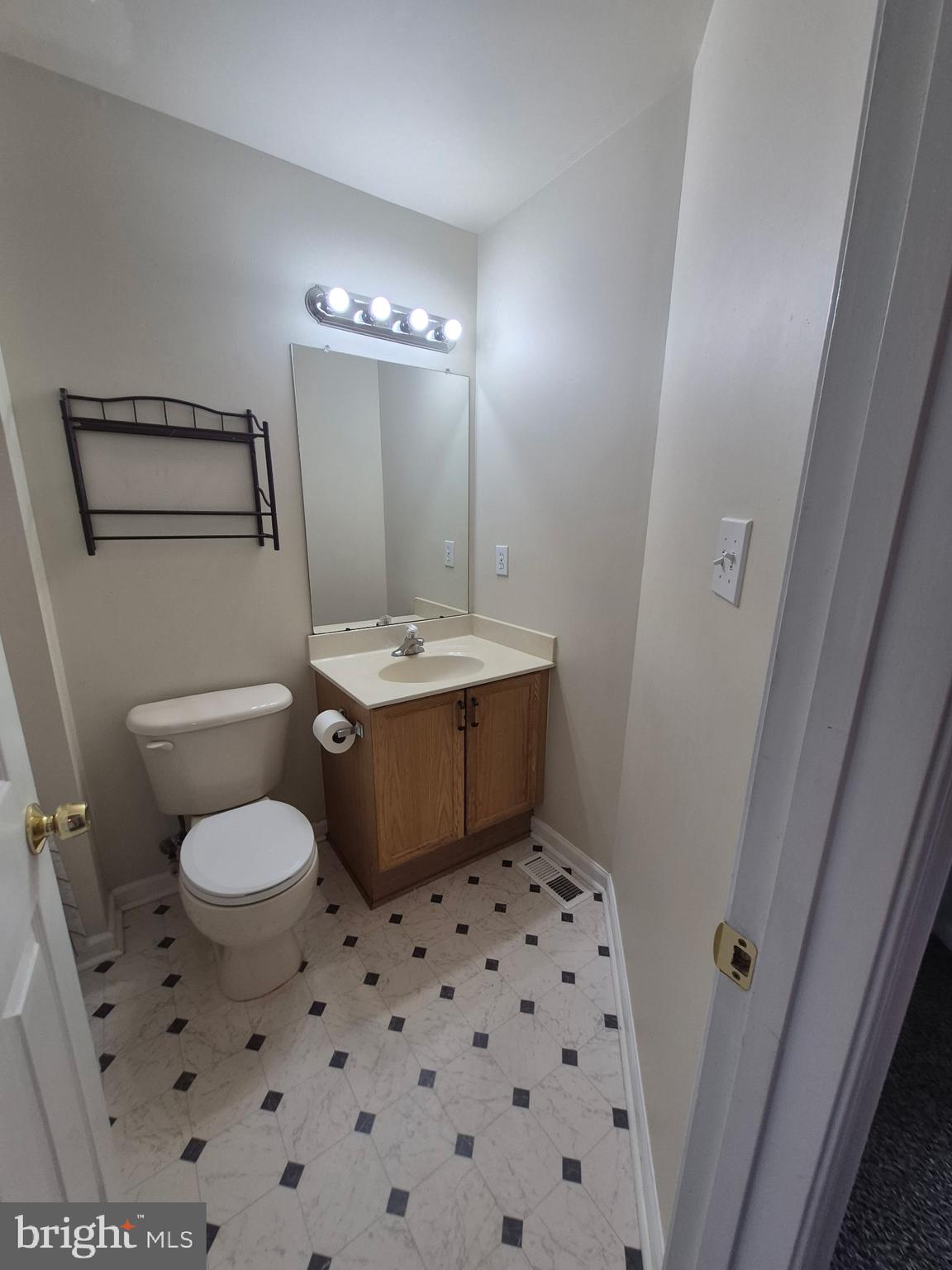 173 Ranson Estates Circle Ranson, WV 25438 - Photo 16 of 20 a bathroom with a sink toilet and mirror