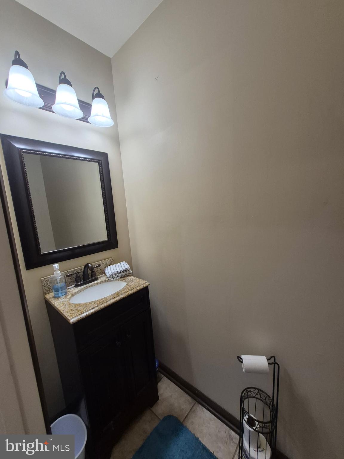 173 Ranson Estates Circle Ranson, WV 25438 - Photo 8 of 20 a bathroom with a toilet sink vanity and mirror