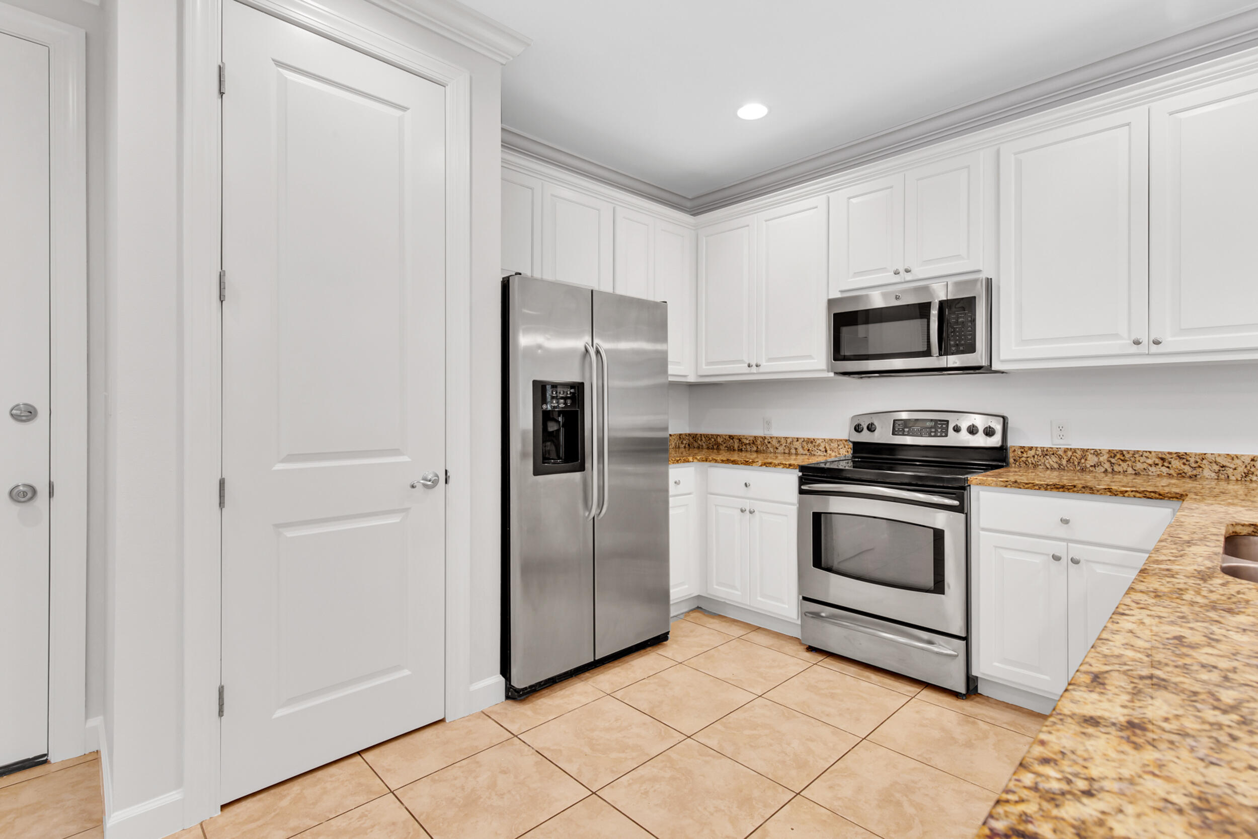 198 South Zander Way Santa Rosa Beach, FL 32459 - Photo 11 of 37 a kitchen with cabinets stainless steel appliances and a counter space