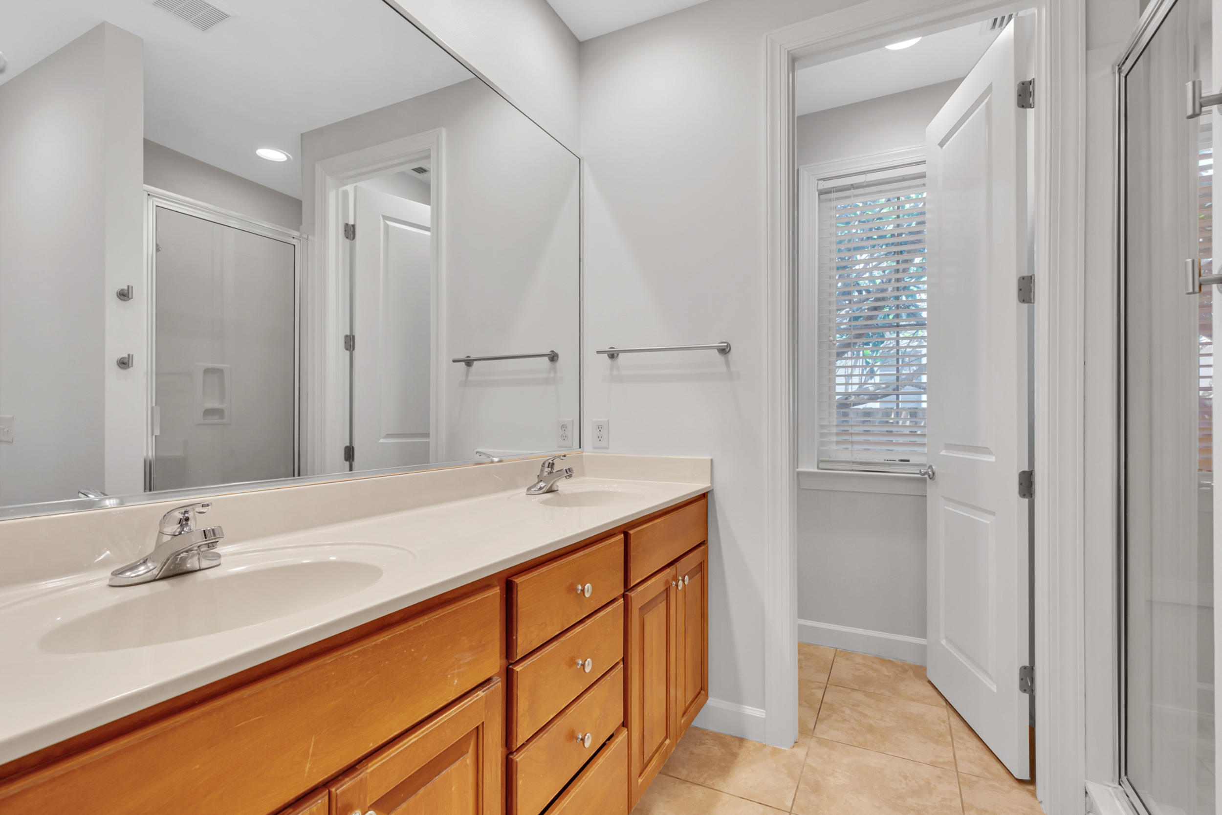 198 South Zander Way Santa Rosa Beach, FL 32459 - Photo 17 of 37 a bathroom with a double vanity sink and a mirror