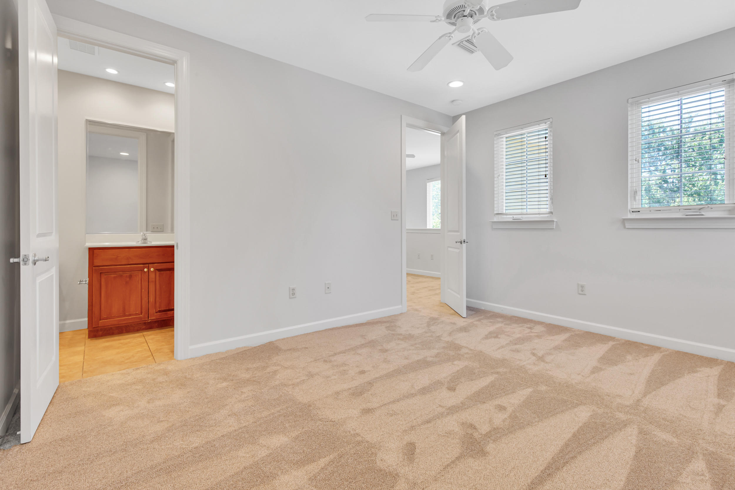 198 South Zander Way Santa Rosa Beach, FL 32459 - Photo 30 of 37 an empty room with windows and chandelier fan