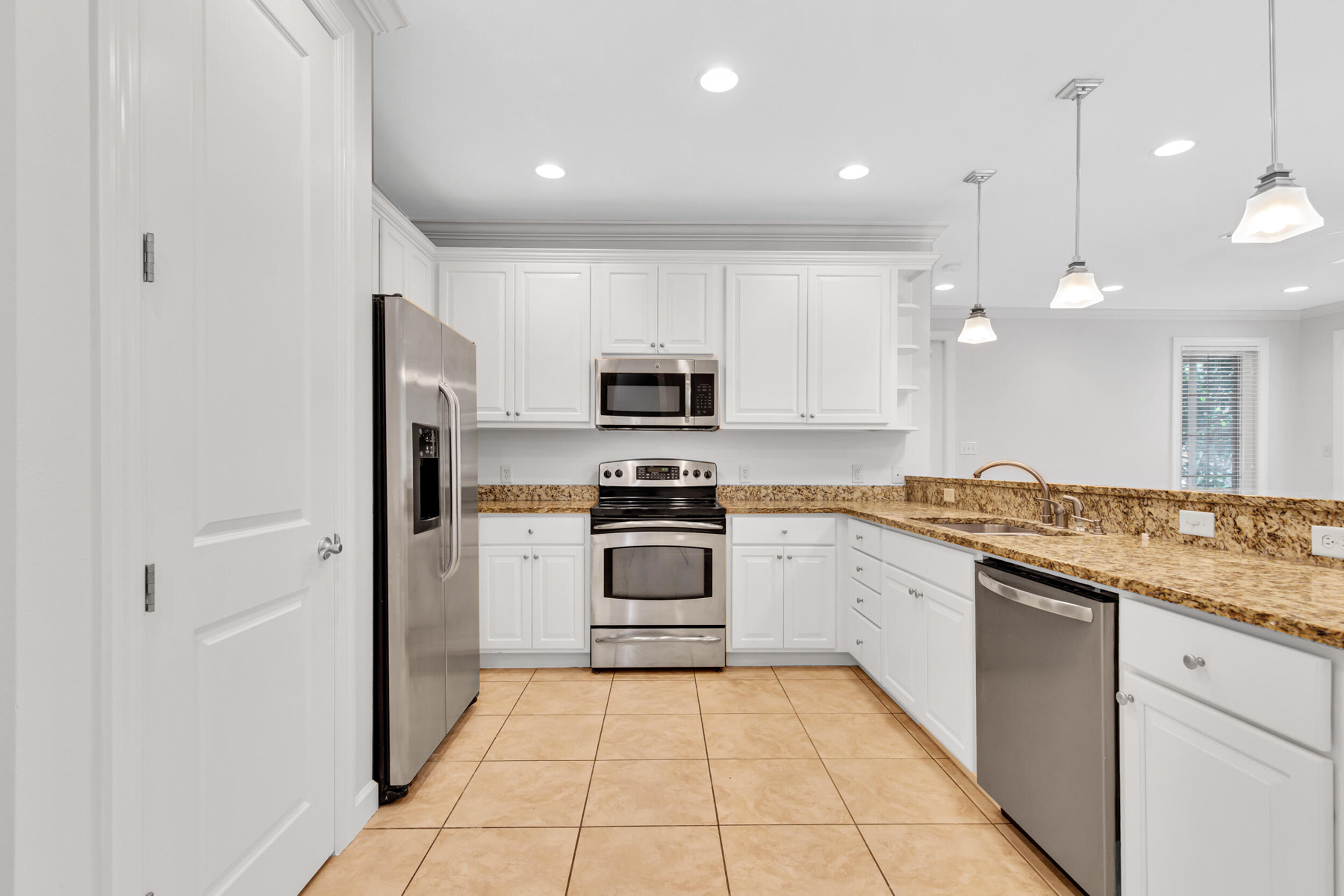 198 South Zander Way Santa Rosa Beach, FL 32459 - Photo 10 of 37 a kitchen with a sink a stove and refrigerator