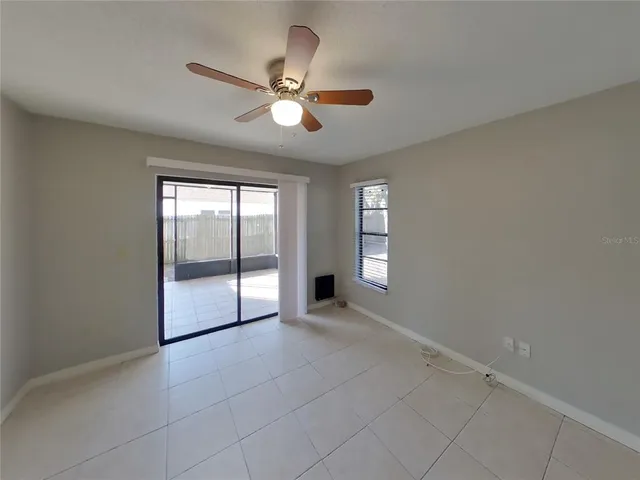a white toilet sitting next to a bath tub