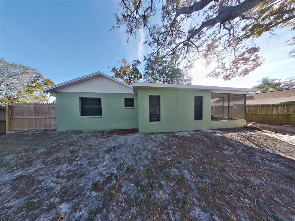 Undisclosed Address Holiday, FL 34691 - Photo 18 of 18 a view of a house with a yard and tree