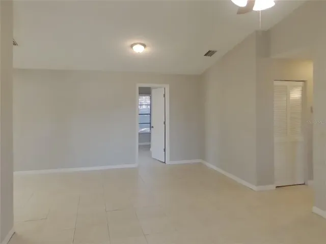 a kitchen with a refrigerator a sink a stove and cabinets