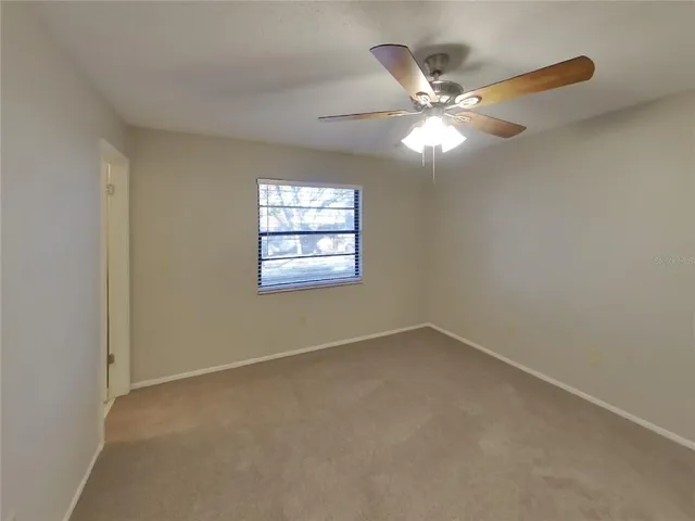a bathroom with a sink mirror and toilet