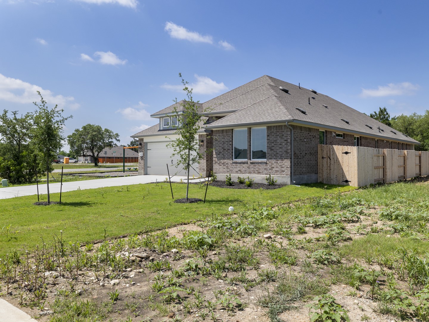 402 Judson Street Bertram, TX 78605 - Photo 2 of 27 a front view of house with a garden