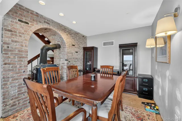 a dining room with furniture and chandelier