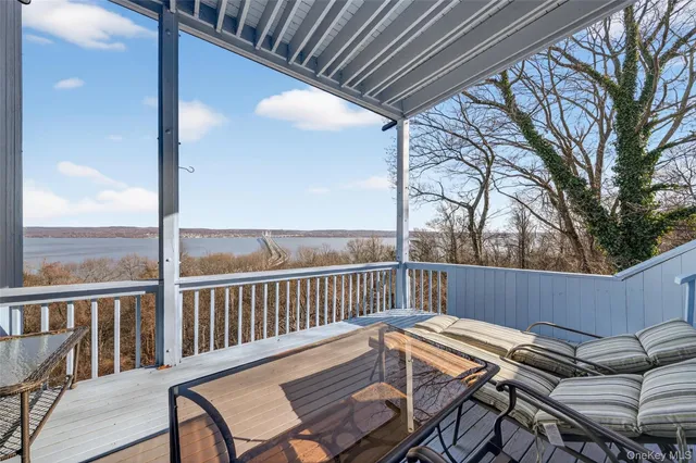 a view of a balcony with furniture