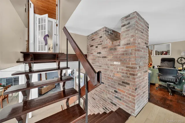 a view of entryway with workspace and stairs