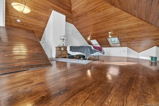 a view of a living room with hardwood