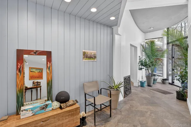 a room with furniture and a potted plant
