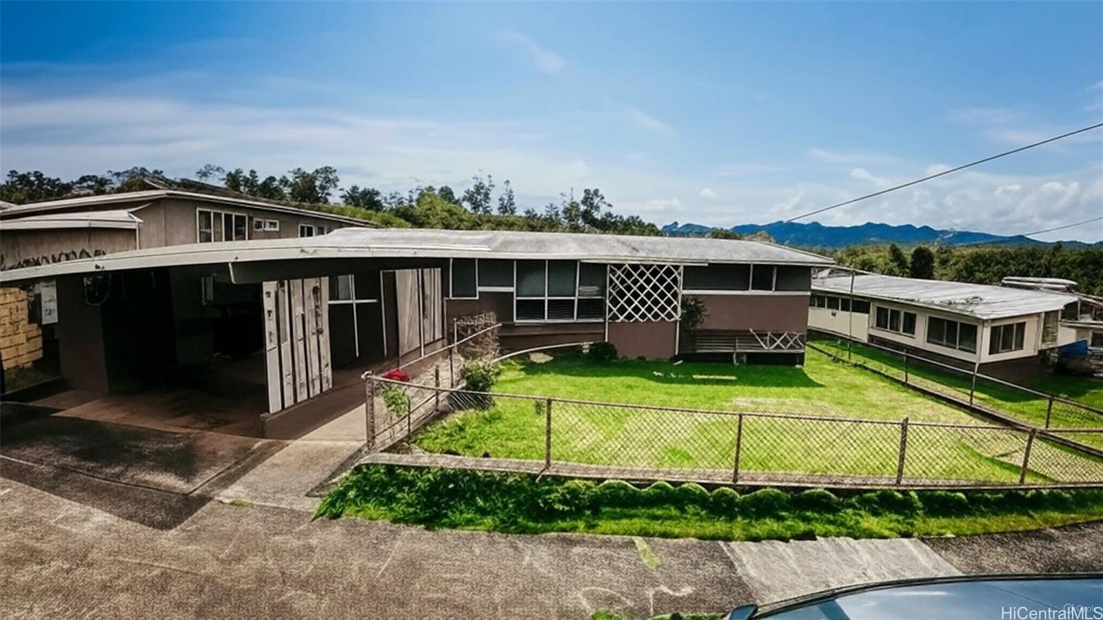95-059 Waihonu Street Mililani, HI 96789 - Photo 1 of 1 a view of a house with a yard