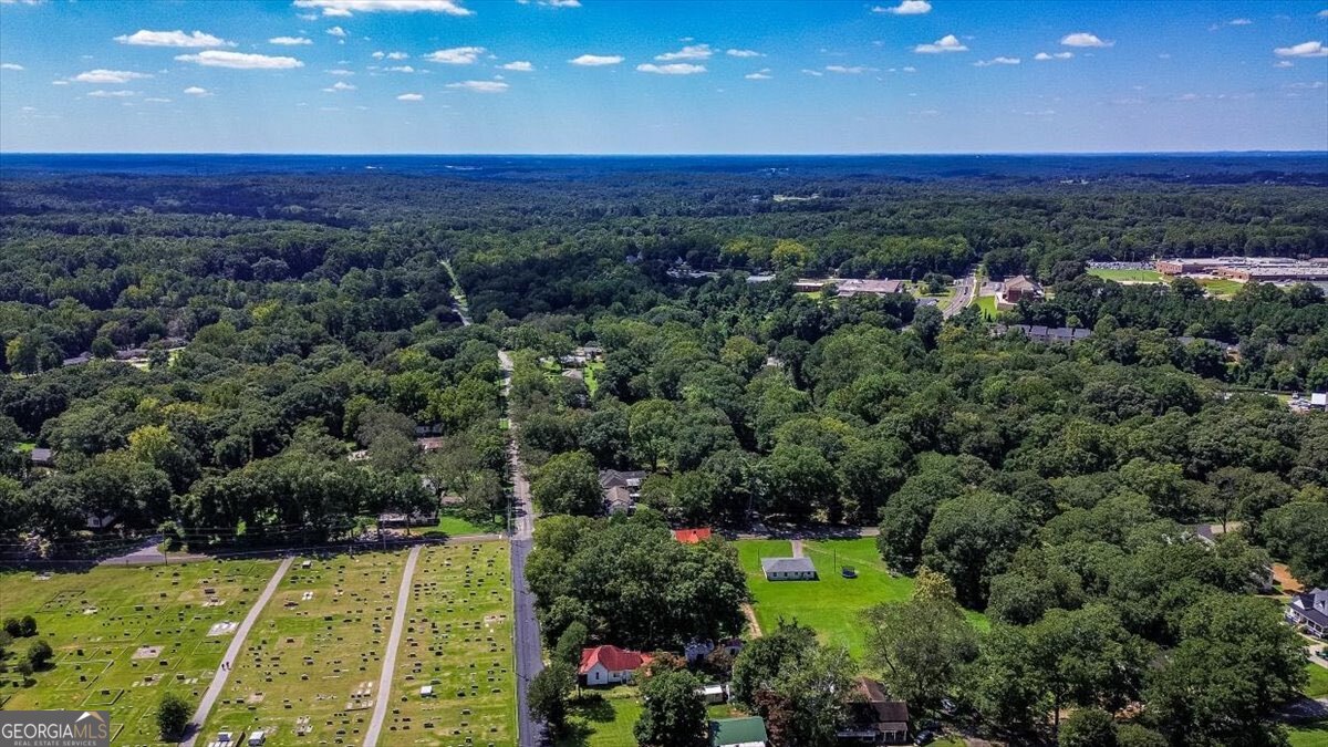 172 Scott Street Commerce, GA 30529 - Photo 5 of 10 a view of a swimming pool with a garden