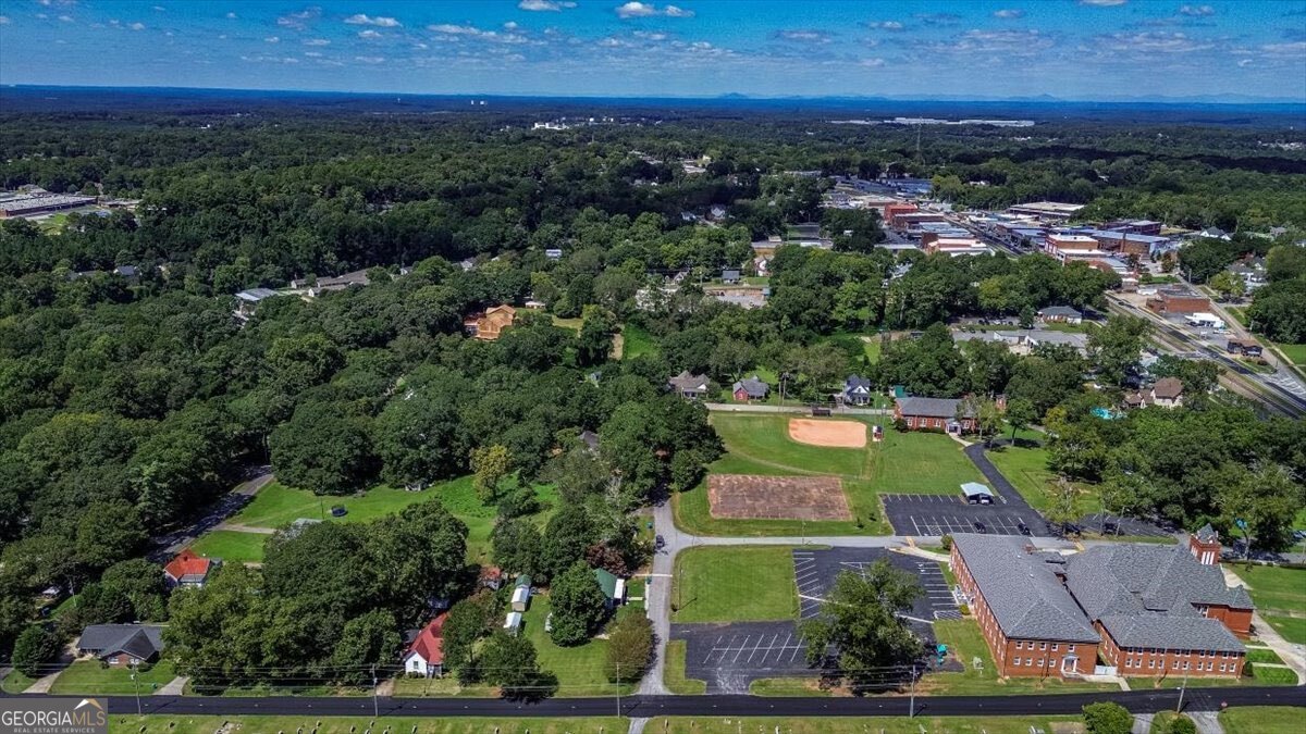 172 Scott Street Commerce, GA 30529 - Photo 7 of 10 an aerial view of residential houses with outdoor space and trees