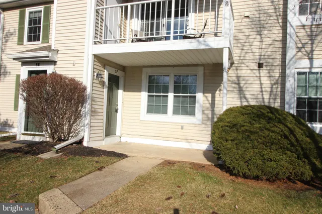 a view of a house with a backyard and a window