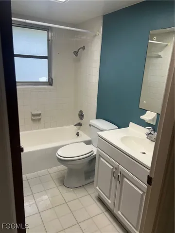 a bathroom with a toilet a sink and bathtub