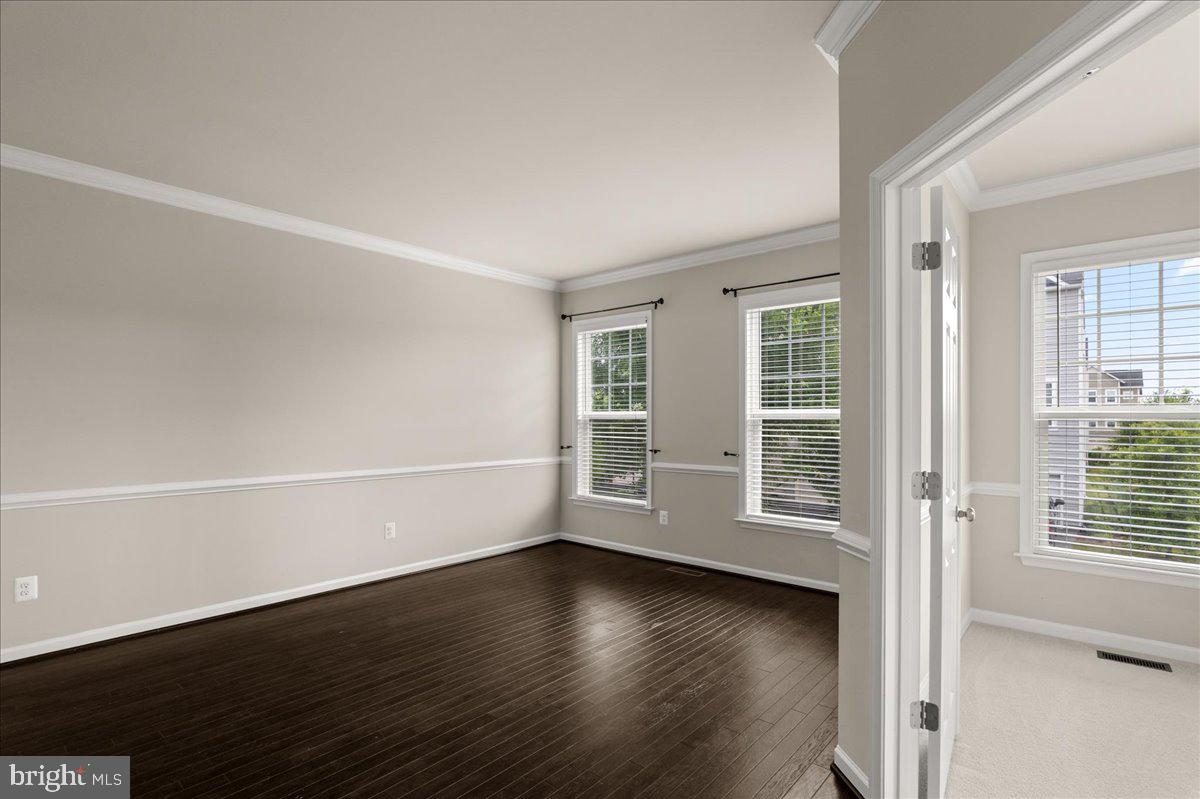 101 Jitterbug Way Stephenson, VA 22656 - Photo 14 of 39 an empty room with wooden floor and windows