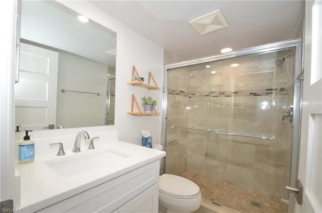 a bedroom with a bed and a table in it