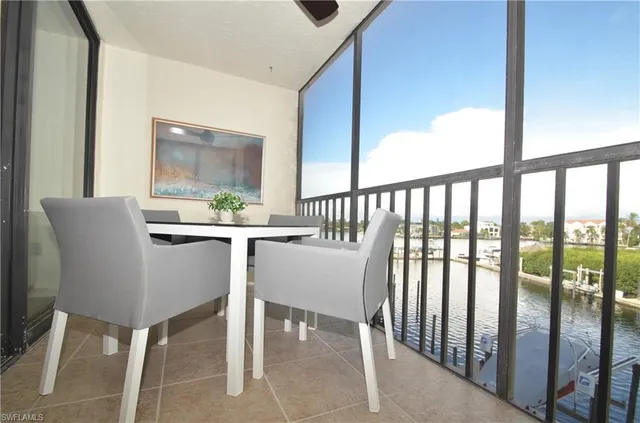 a view of a swimming pool with chairs
