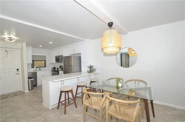 a view of a livingroom with furniture and a window