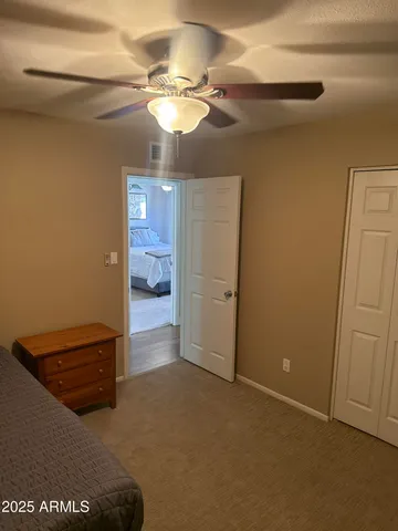 a view of room with a ceiling fan