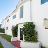 a view of house with backyard and garden