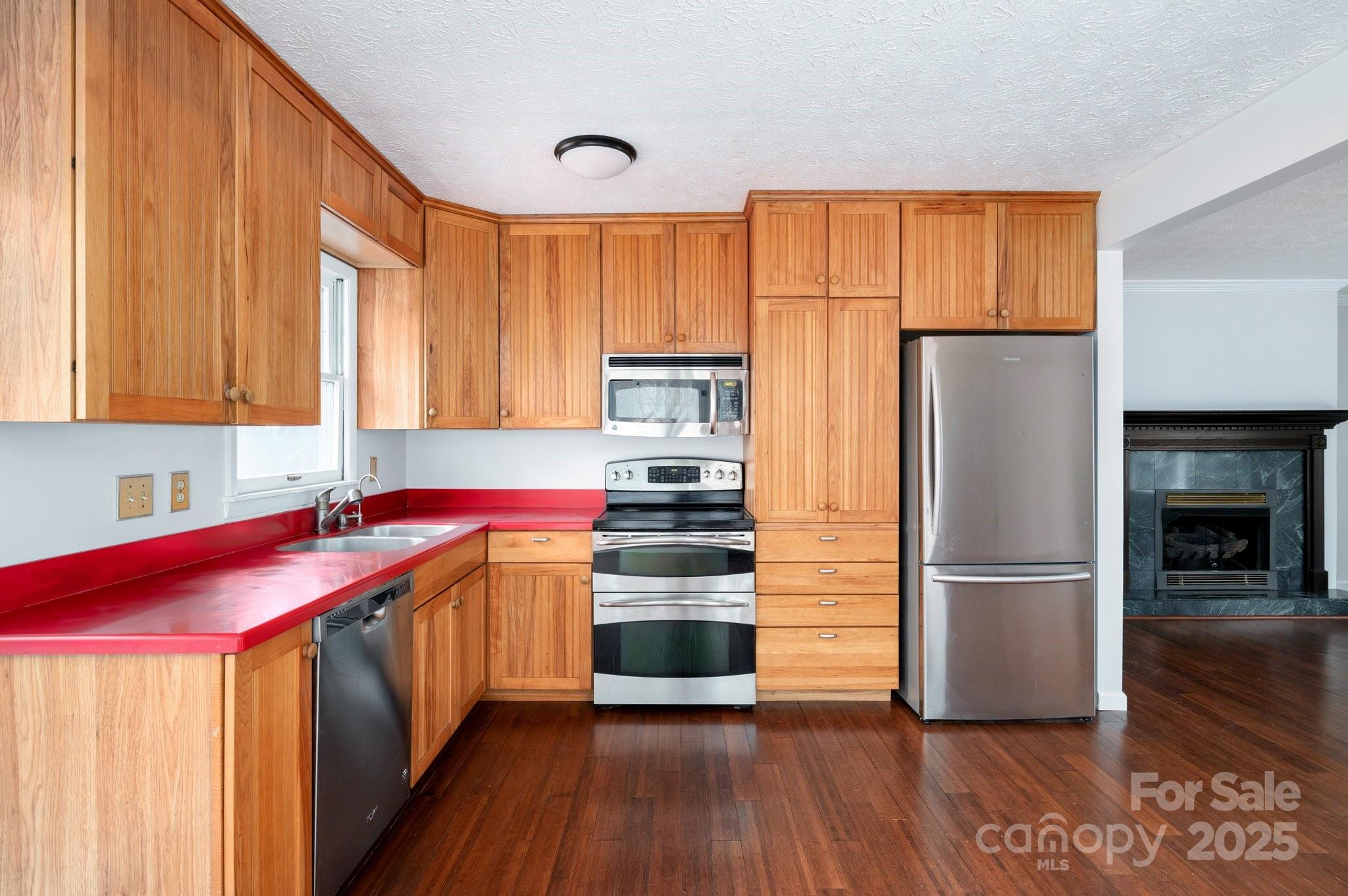 148 Pinecrest Drive Alexander, NC 28701 - Photo 14 of 31 a kitchen with stainless steel appliances granite countertop a refrigerator and a stove top oven