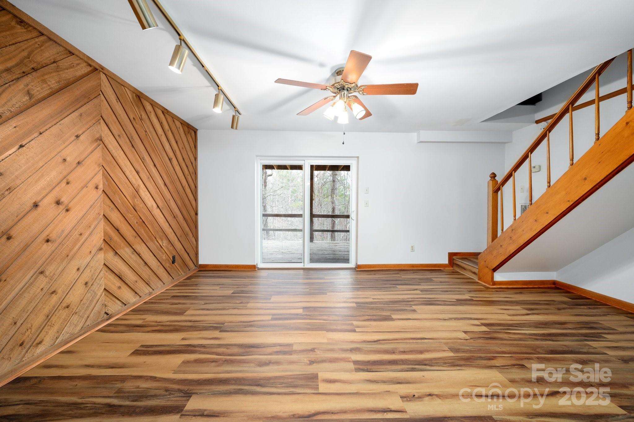 148 Pinecrest Drive Alexander, NC 28701 - Photo 20 of 31 a view of an empty room with window and wooden floor