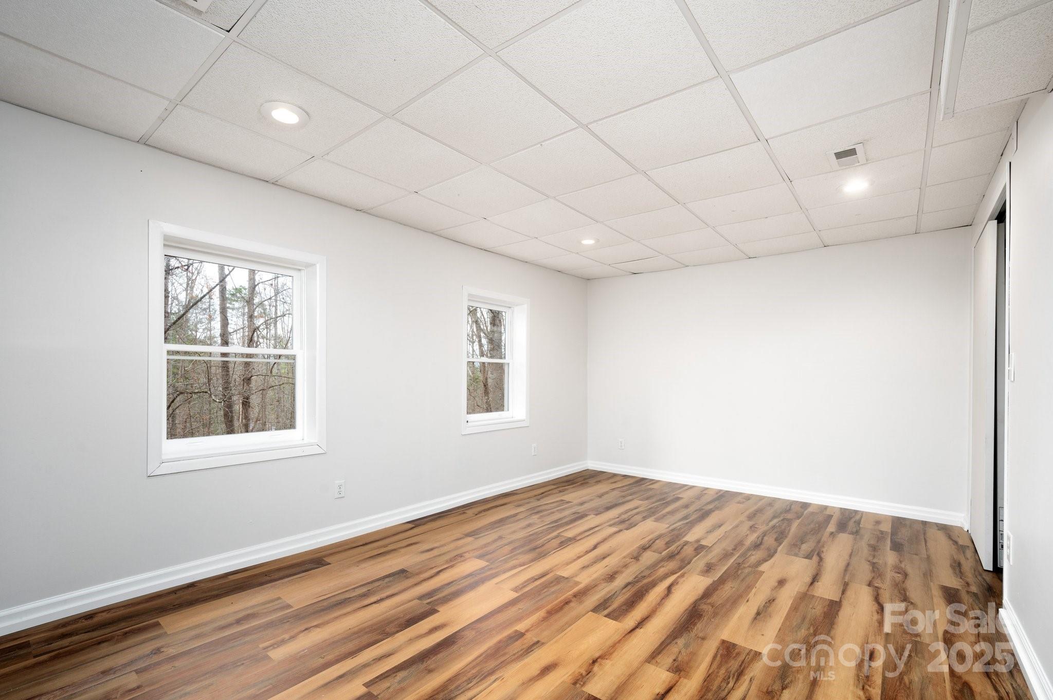 148 Pinecrest Drive Alexander, NC 28701 - Photo 22 of 31 a view of empty room with wooden floor