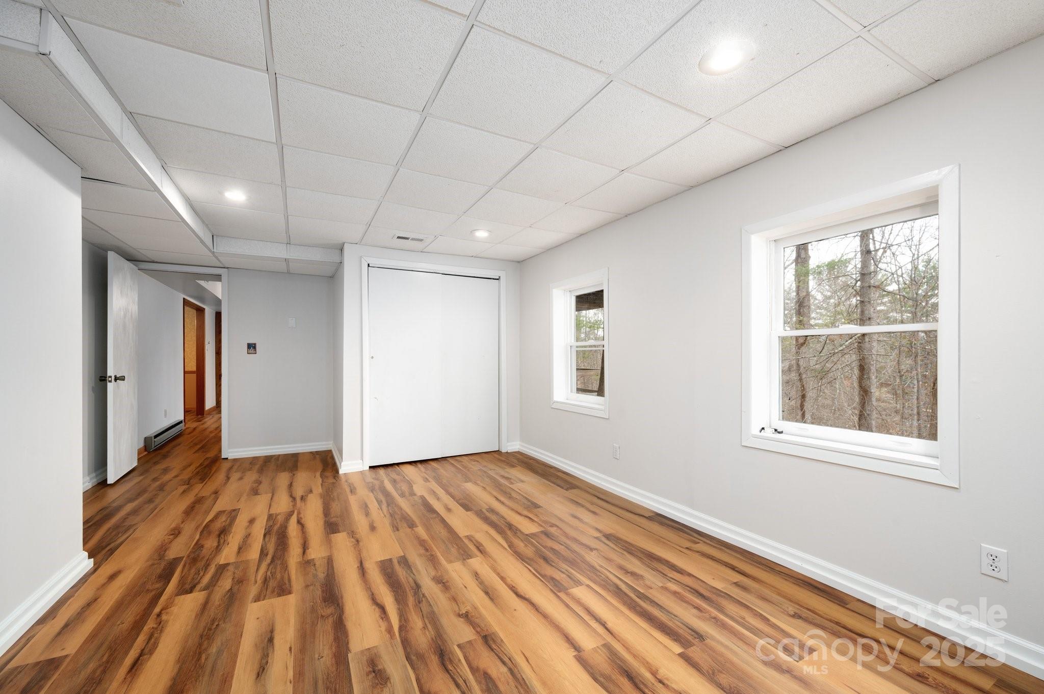 148 Pinecrest Drive Alexander, NC 28701 - Photo 23 of 31 a view of empty room with wooden floor and fan