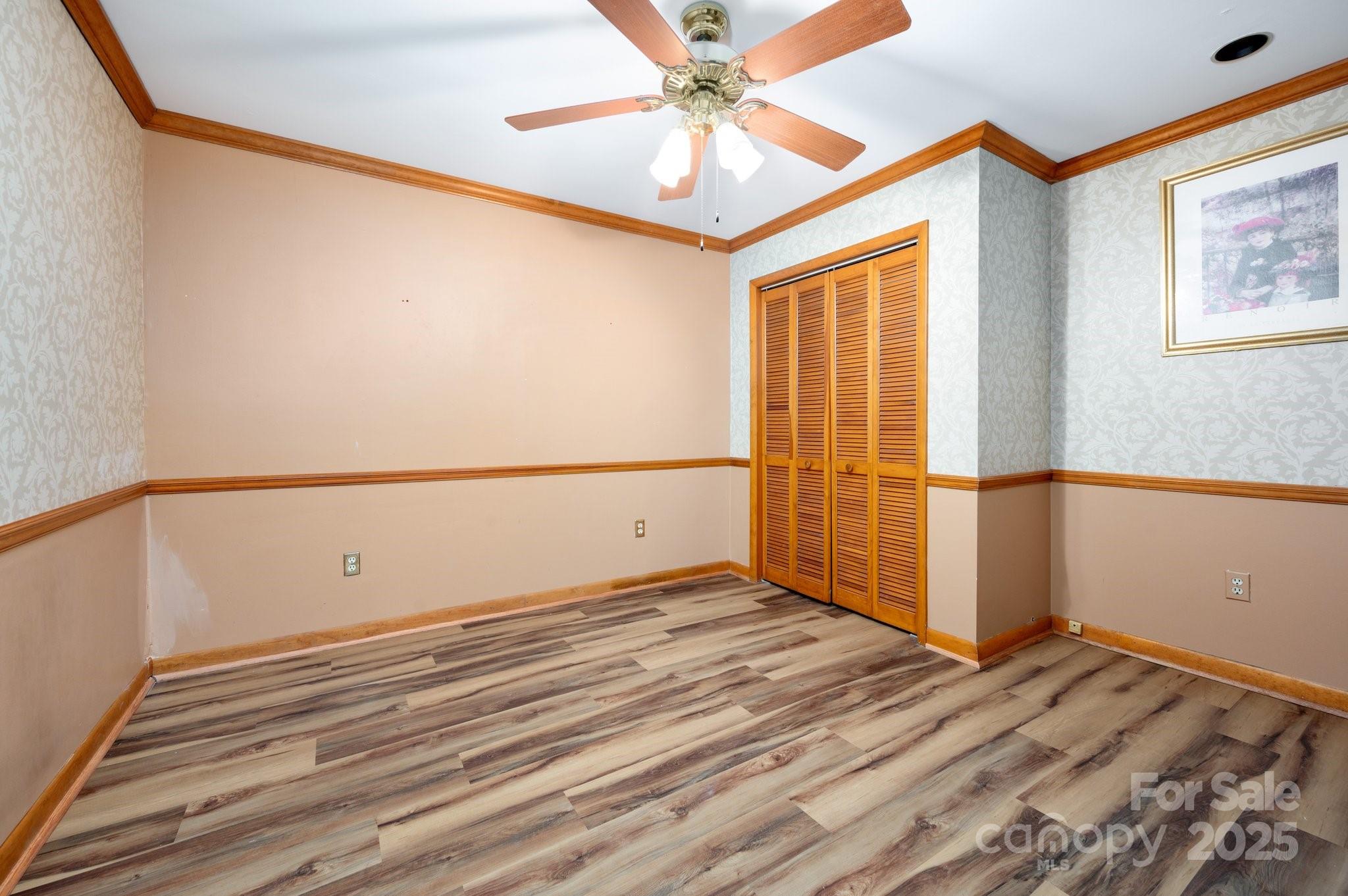 148 Pinecrest Drive Alexander, NC 28701 - Photo 27 of 31 an empty room with wooden floor and windows