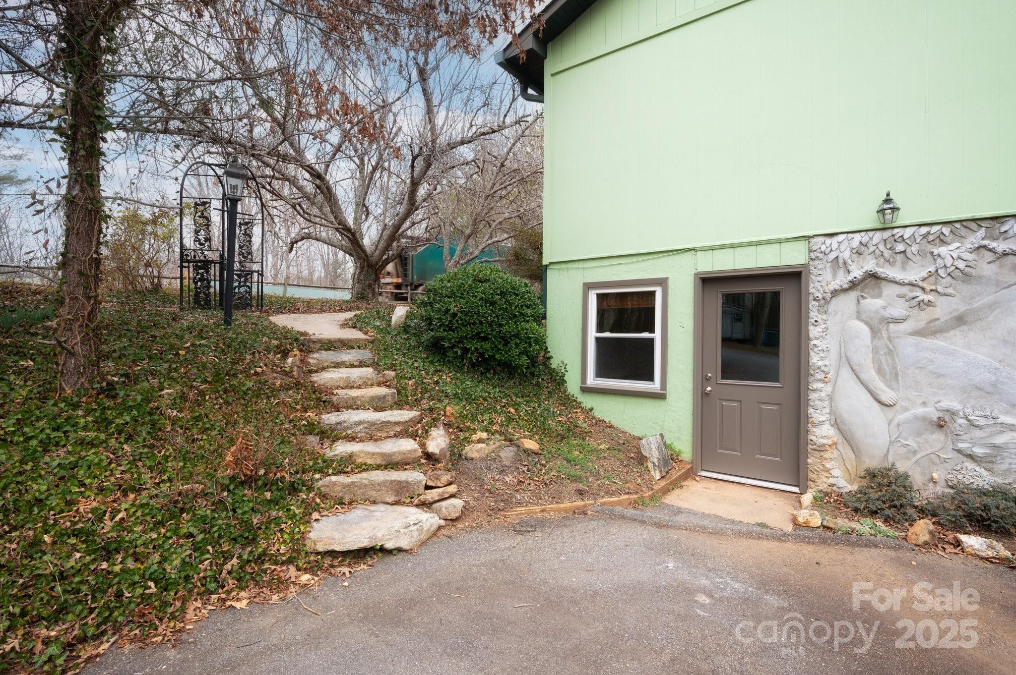 148 Pinecrest Drive Alexander, NC 28701 - Photo 3 of 31 a front view of a house with garden