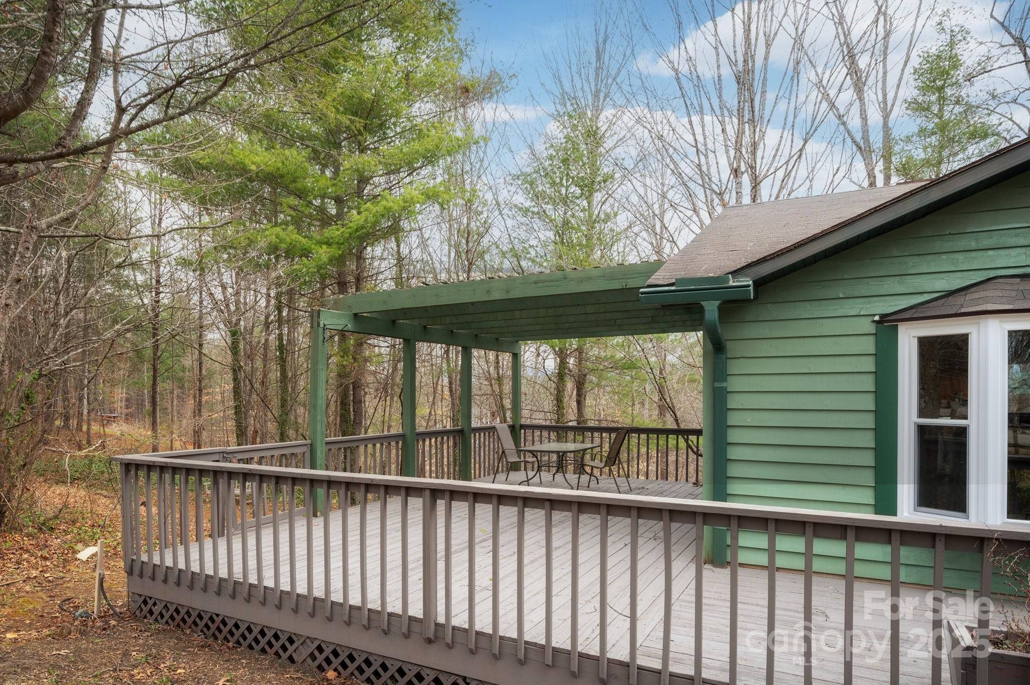 148 Pinecrest Drive Alexander, NC 28701 - Photo 7 of 31 a view of a small yard and large trees