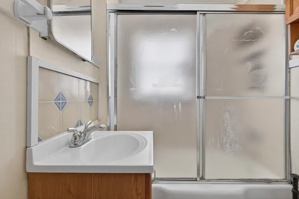 a bathroom with a sink and a mirror