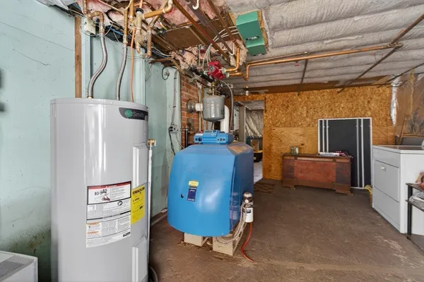 a room with furniture a washer and dryer