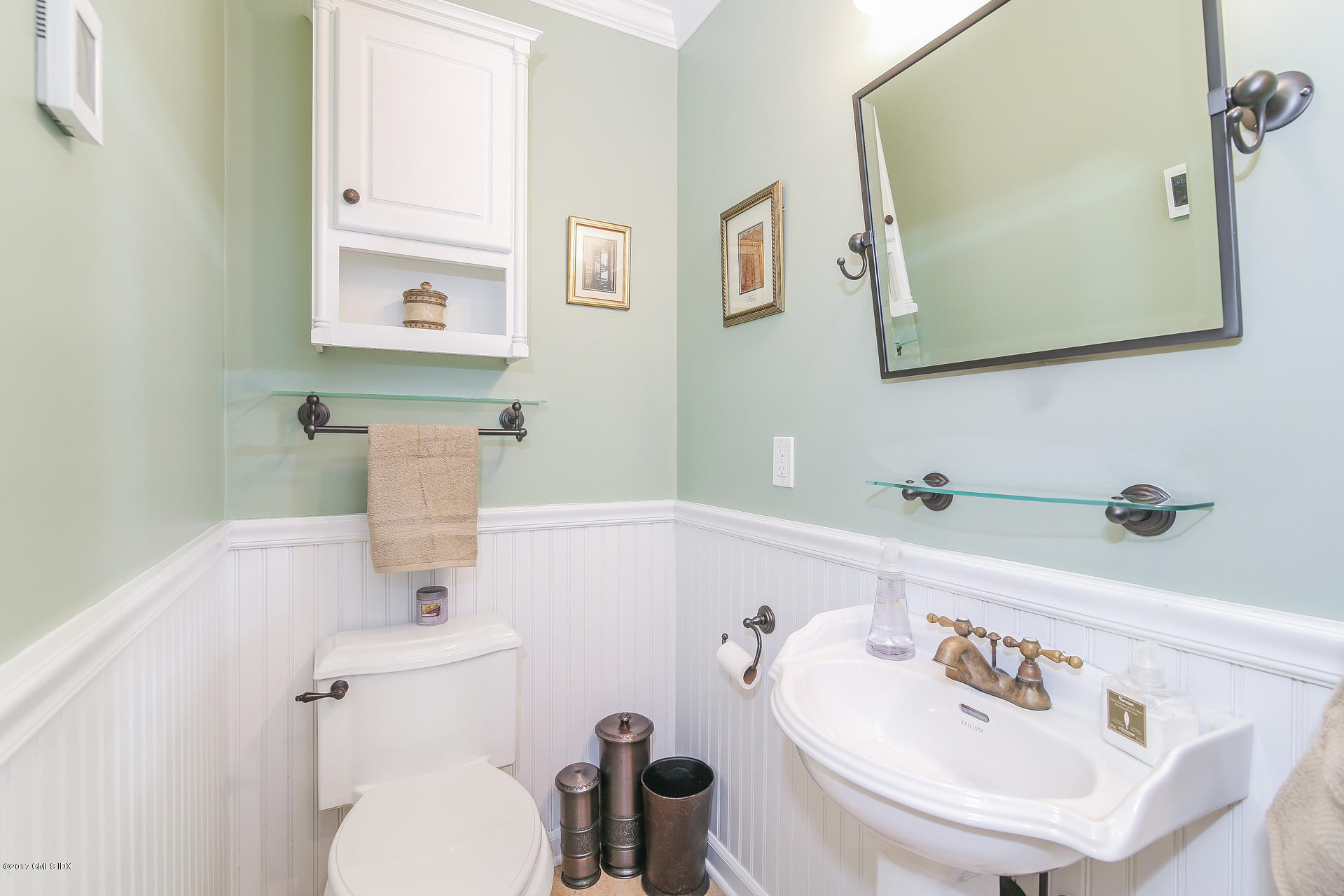 22 Griffith Road Riverside, CT 06878 - Photo 18 of 40 a bathroom with a toilet sink and mirror