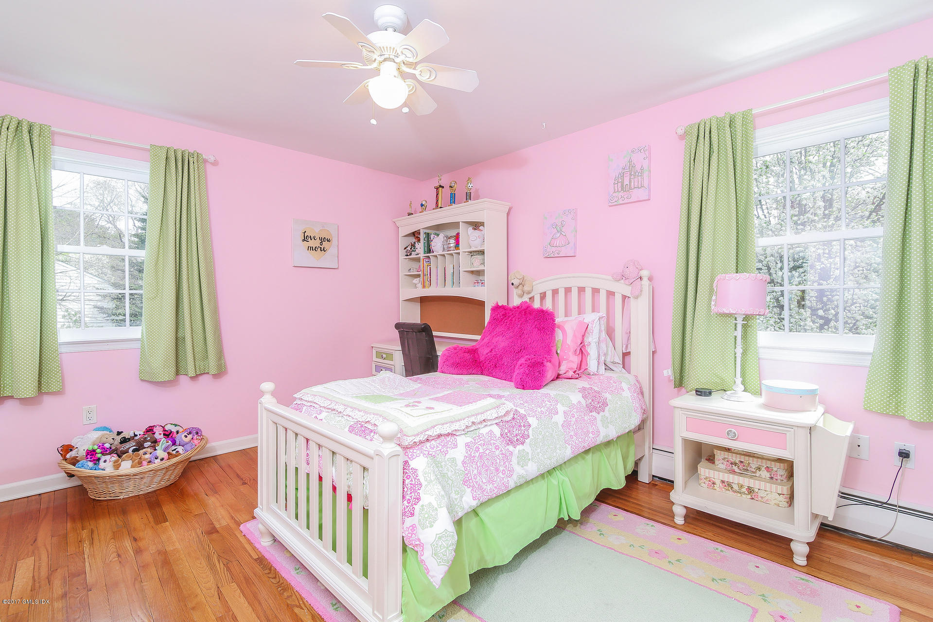 22 Griffith Road Riverside, CT 06878 - Photo 27 of 40 a bedroom with a bed and a chandelier