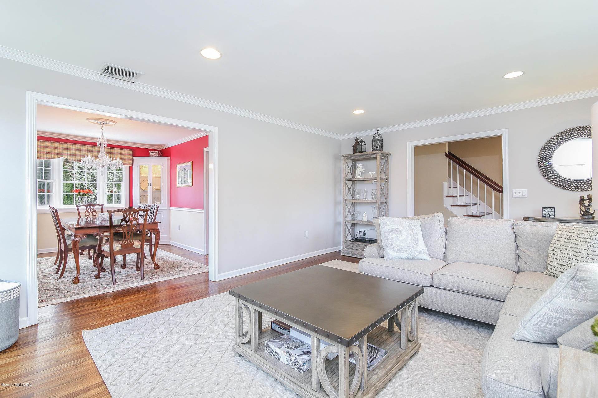 22 Griffith Road Riverside, CT 06878 - Photo 8 of 40 a living room with furniture a dining table and a large window