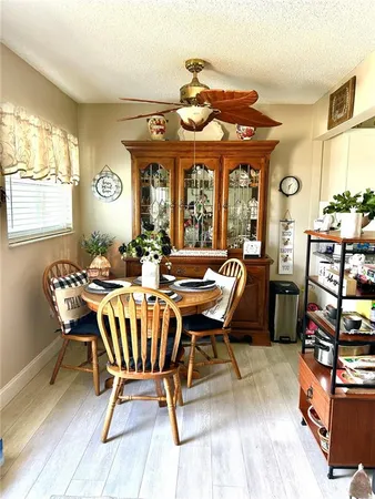 a view of a dining room with furniture window and outside view