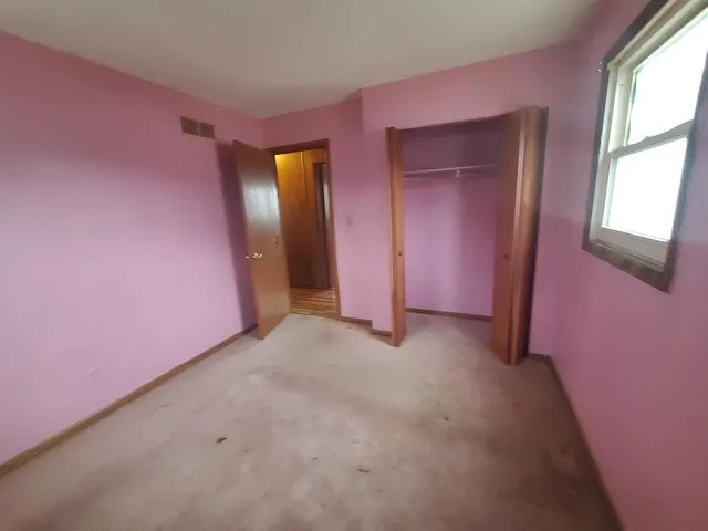 a view of an empty room with window