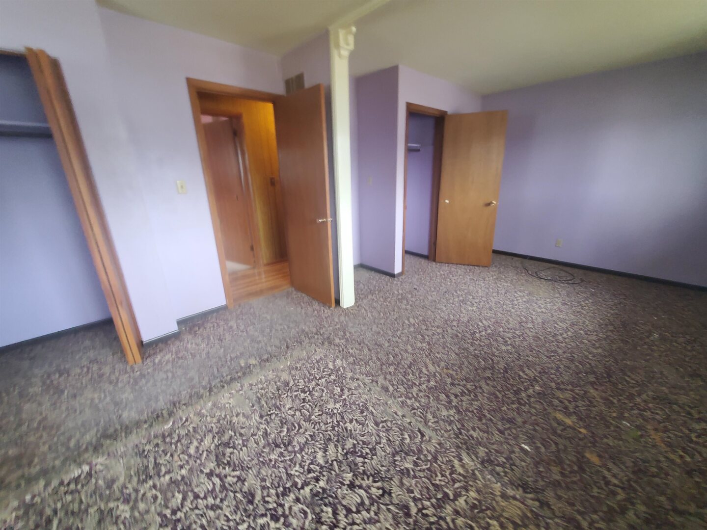 3305 3rd St A East Moline, IL 61244 - Photo 7 of 12 an empty room with closet and mirror