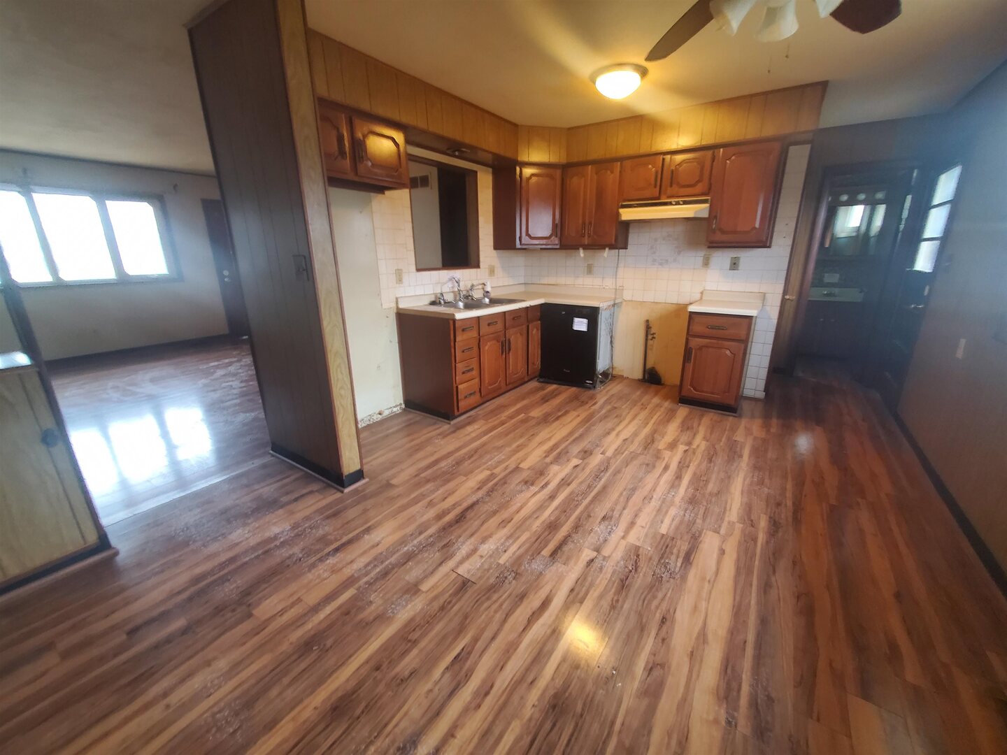 3305 3rd St A East Moline, IL 61244 - Photo 8 of 12 a kitchen with stainless steel appliances a refrigerator a sink dishwasher a stove and white countertops with wooden floor