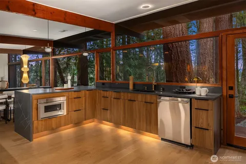 a kitchen with stainless steel appliances granite countertop a stove and a sink
