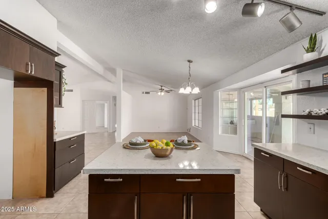 a kitchen with a counter space cabinets and appliances