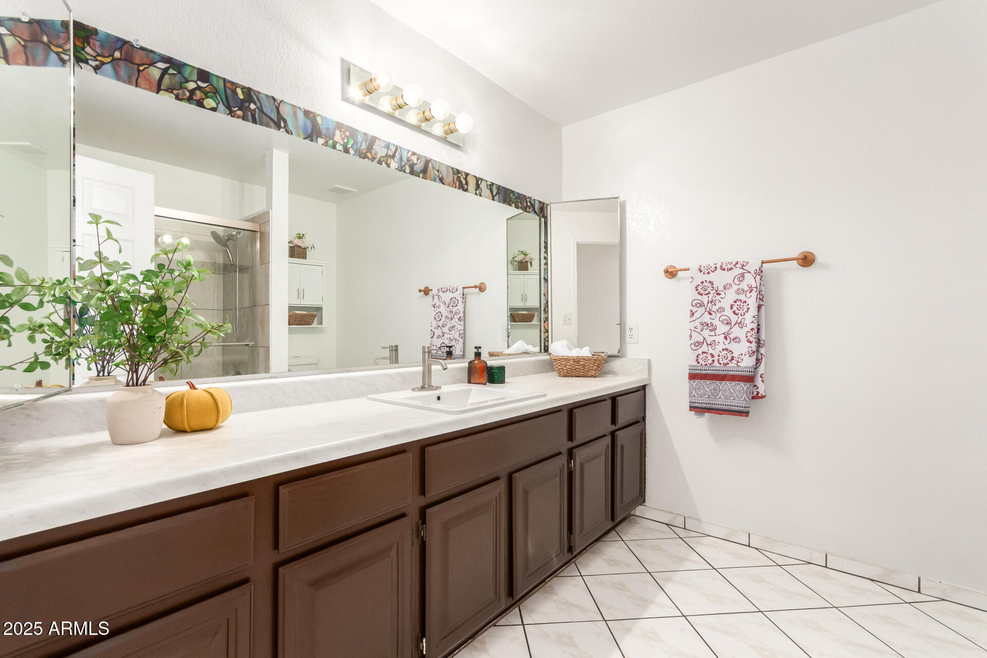 3419 North 70th Avenue Phoenix, AZ 85033 - Photo 20 of 31 a bathroom with a sink and a mirror