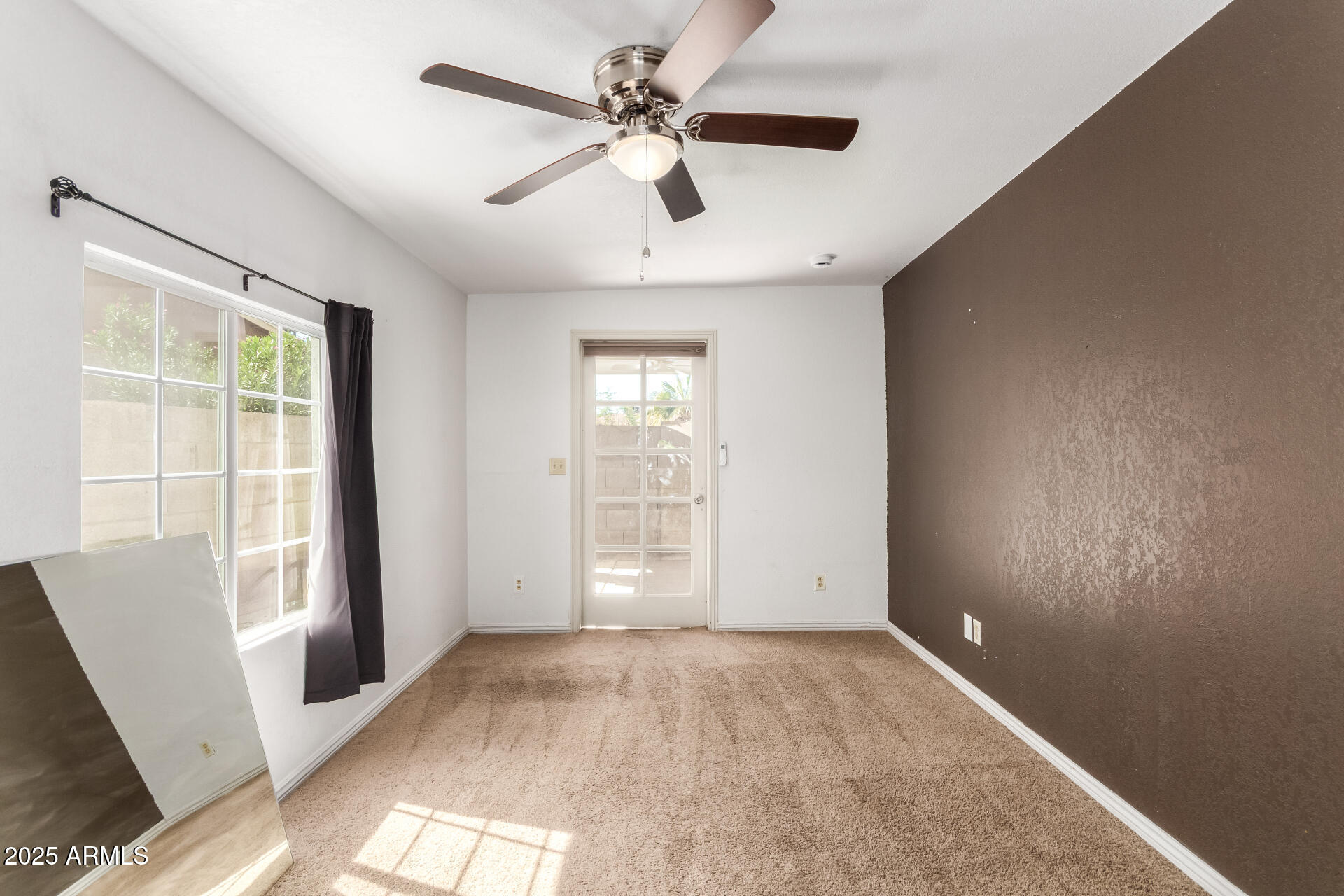 3419 North 70th Avenue Phoenix, AZ 85033 - Photo 23 of 31 wooden floor in an empty room with a window