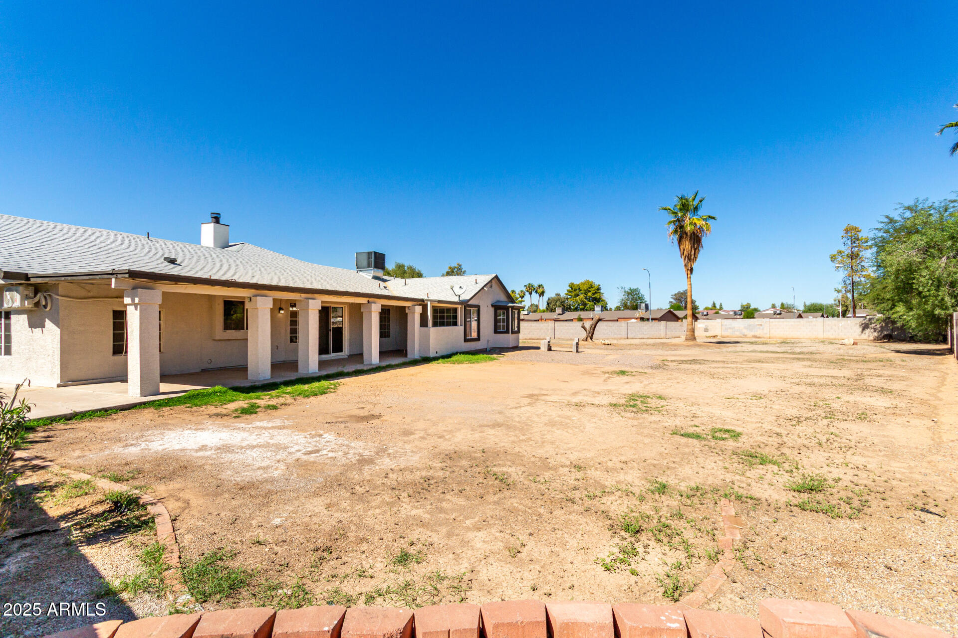 3419 North 70th Avenue Phoenix, AZ 85033 - Photo 25 of 31 a front view of a house with a yard